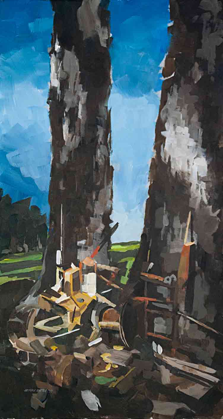 two tree trunks with garbage at base